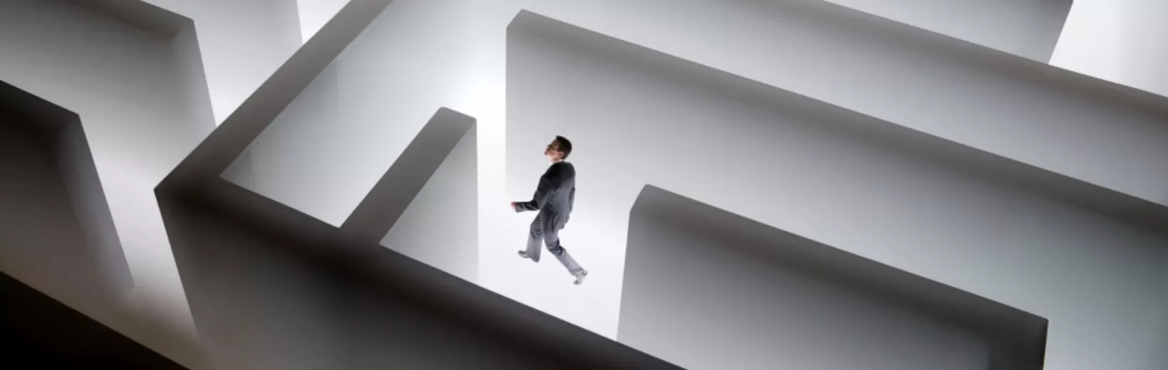 Illustration of a man walking in a maze
